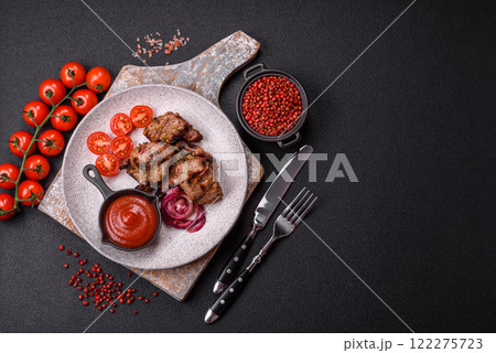 Pieces of beef meat cut into slices, marinated with salt and spices Pieces of beef meat cut into slices, marinated with salt and spices 122275723