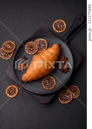 Golden crispy croissant with a sweet creamy fruit filling Golden crispy croissant with a sweet creamy fruit filling 122275888