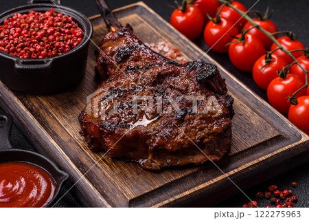Grilled wagyu beef tomahawk steak with salt, spices and herbs Grilled wagyu beef tomahawk steak with salt, spices and herbs 122275963