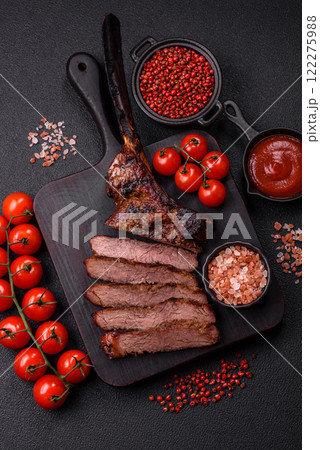 Grilled wagyu beef tomahawk steak with salt, spices and herbs 122275988
