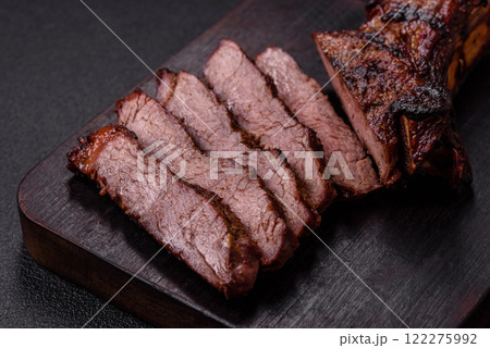 Grilled wagyu beef tomahawk steak with salt, spices and herbs 122275992