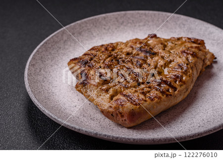 Grilled beef or pork steak with salt, spices and herbs 122276010