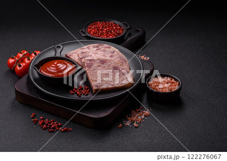 Homemade headcheese with salt, spices, herbs and vegetables Homemade headcheese with salt, spices, herbs and vegetables 122276067
