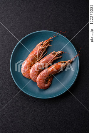 Boiled tiger prawns with salt, spices, herbs and vegetables Boiled tiger prawns with salt, spices, herbs and vegetables 122276083