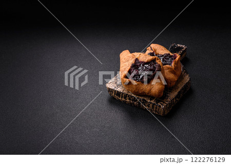 Sweet rye pies with cherries and chocolate Sweet rye pies with cherries and chocolate 122276129