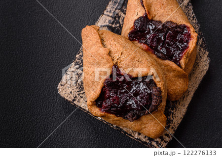 Sweet rye pies with cherries and chocolate 122276133