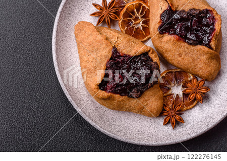 Sweet rye pies with cherries and chocolate Sweet rye pies with cherries and chocolate 122276145