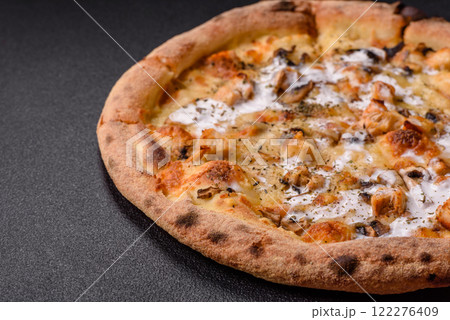 Creamy pizza with truffle cheese, mozzarella, chicken and mushrooms Creamy pizza with truffle cheese, mozzarella, chicken and mushrooms 122276409