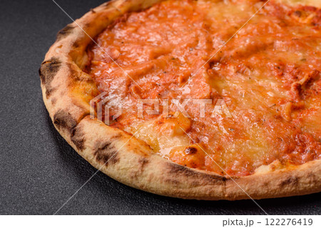 Pizza margherita with cheese, tomatoes, salt, spices and herbs 122276419