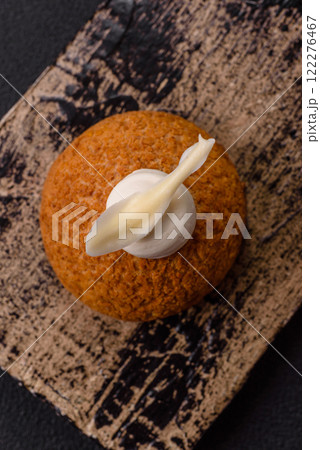 Delicious sweet shu cake with cream and nuts 122276467