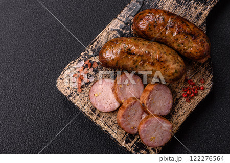 Juicy sausages with salt, spices and herbs 122276564