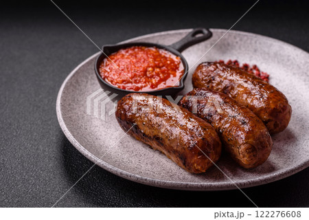 Juicy sausages with salt, spices and herbs Juicy sausages with salt, spices and herbs 122276608