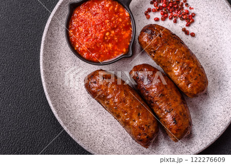 Juicy sausages with salt, spices and herbs 122276609