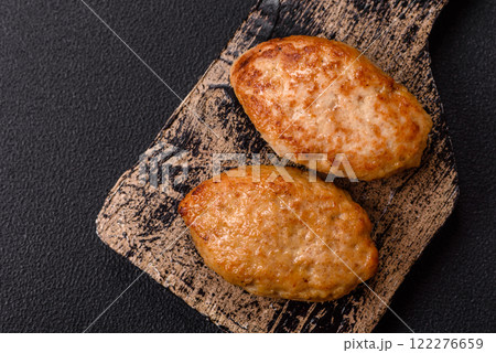 Delicious fresh fried minced fish cutlets with spices and herbs 122276659