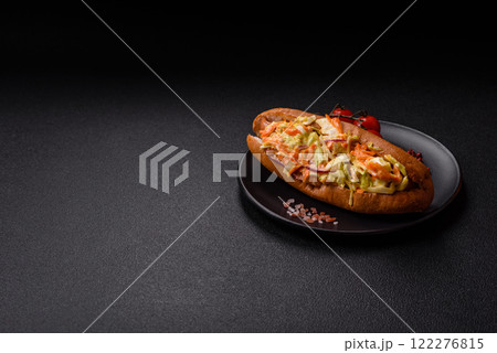 Hotdog with grilled sausage with cabbage, carrots and onions Hotdog with grilled sausage with cabbage, carrots and onions 122276815