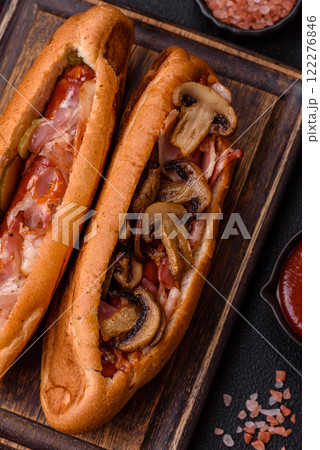 Hotdog with grilled sausage with bacon and mushrooms Hotdog with grilled sausage with bacon and mushrooms 122276846