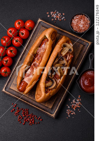 Hotdog with grilled sausage with bacon and mushrooms Hotdog with grilled sausage with bacon and mushrooms 122276849