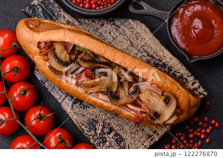 Hotdog with grilled sausage with bacon and mushrooms 122276870