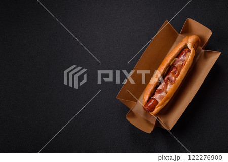 Hotdog with grilled sausage with bacon and mushrooms Hotdog with grilled sausage with bacon and mushrooms 122276900