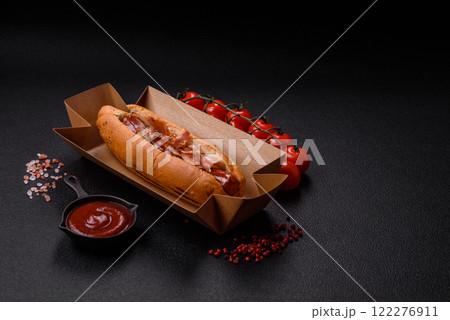 Hotdog with grilled sausage with bacon and mushrooms 122276911