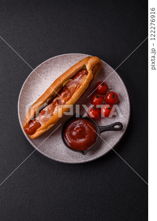 Hotdog with grilled sausage with bacon and mushrooms Hotdog with grilled sausage with bacon and mushrooms 122276916