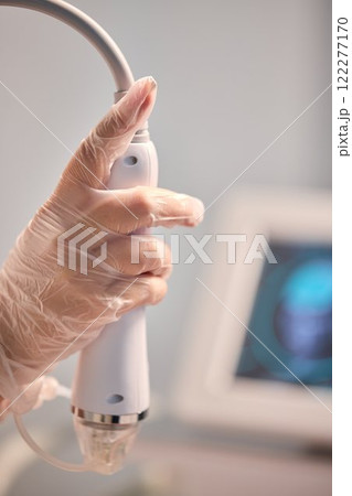 A man is currently undergoing a specialized facial treatment within a serene spa setting A man is currently undergoing a specialized facial treatment within a serene spa setting 122277170