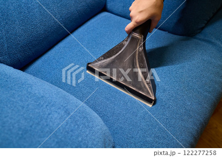 The Upholstery Cleaning Process Effectively Freshening Up a Beautiful Blue Couch 122277258