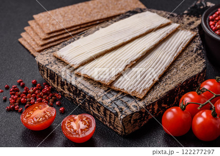 Rectangular whole grain crisp bread with cream cheese 122277297