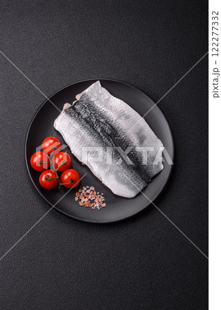 Herring fillet salted and marinated with salt, spices and oil 122277332