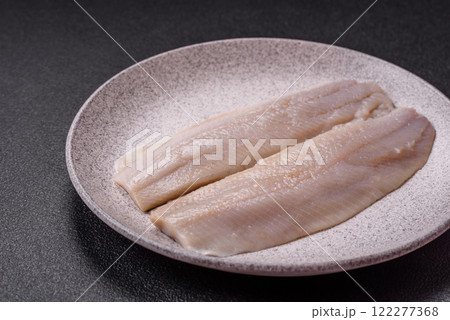 Herring fillet salted and marinated with salt, spices and oil 122277368