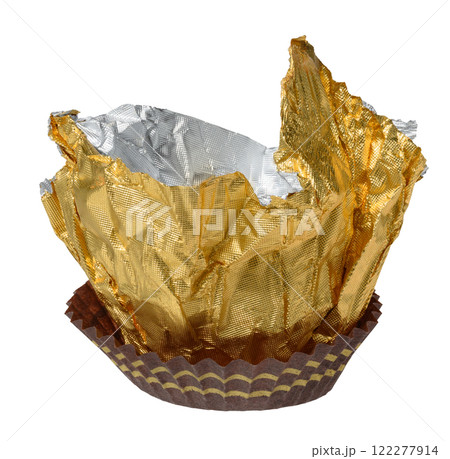 Crumpled sheet of yellow foil in paper basket, candy wrapper 122277914