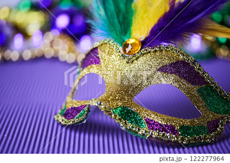 Mardi Gras Mask on purple background 122277964