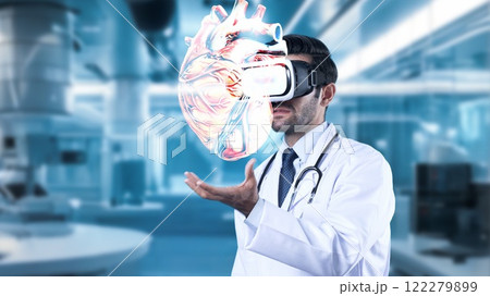 Doctor with VR headset pointing at heart hologram at laboratory. Apparatus. 122279899