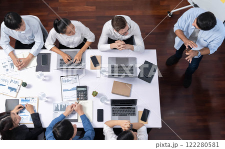 Analyst team utilizing BI Fintech to analyze financial data at table. Prudent Analyst team utilizing BI Fintech to analyze financial data at table. Prudent 122280581