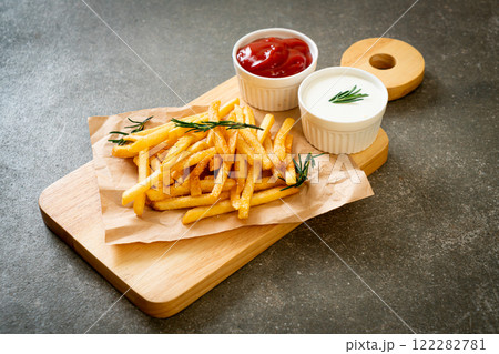 French fries with sour cream and ketchup French fries with sour cream and ketchup 122282781
