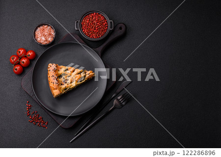 Pieces of quiche with salmon, spinach or broccoli, salt and spices Pieces of quiche with salmon, spinach or broccoli, salt and spices 122286896