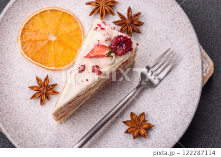 Piece of sweet layer cake with white cream, raspberries and strawberries Piece of sweet layer cake with white cream, raspberries and strawberries 122287114