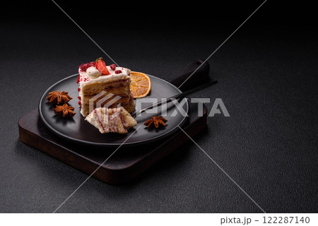 Piece of sweet layer cake with white cream, raspberries and strawberries Piece of sweet layer cake with white cream, raspberries and strawberries 122287140