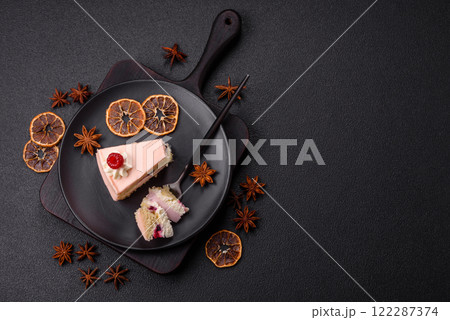 Piece of sweet cake with pink cream with raspberry flavor, with shortbread, cheesecake Piece of sweet cake with pink cream with raspberry flavor, with shortbread, cheesecake 122287374