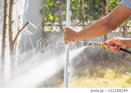 air conditioning filter cleaning with water spray air conditioning filter cleaning with water spray 122288240