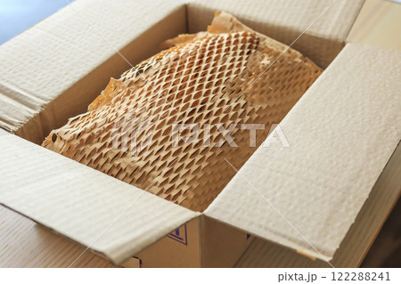 Eco friendly brown paper honeycomb wrap for product packaging parcel carton box 122288241