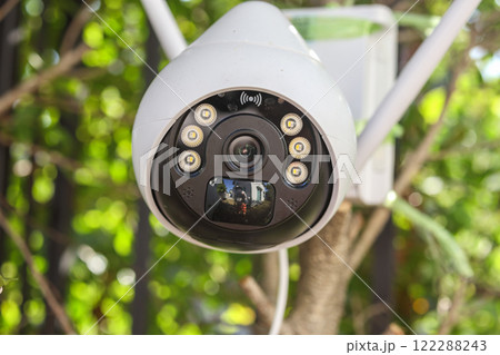 Security IP CCTV camera using solar energy install on the tree for home security system 122288243