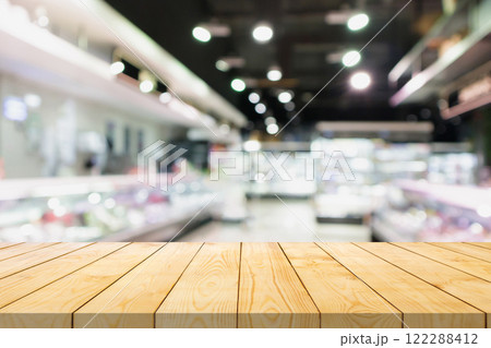Empty wood table top with supermarket blurred background for product display 122288412