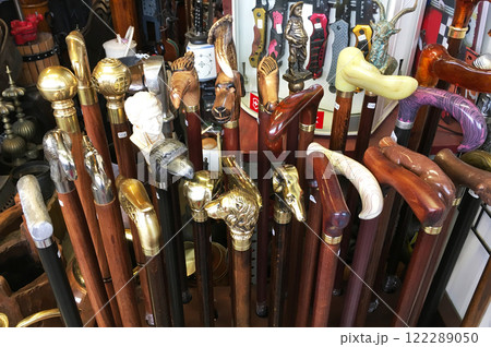 BARCELONA, SPAIN - MAY 09, 2018. Antiquary dealer shop in Barcelona. Old men's canes 122289050