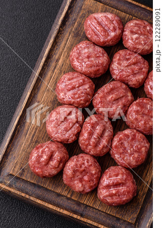 Raw meatballs of minced meat beef, pork or chicken with salt, spices 122289091