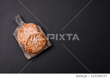 Grilled chicken burger cutlet with salt, spices and herbs 122289157