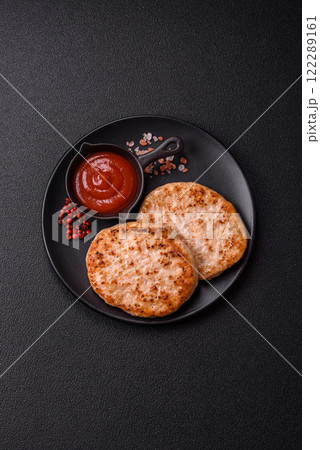 Grilled chicken burger cutlet with salt, spices and herbs 122289161