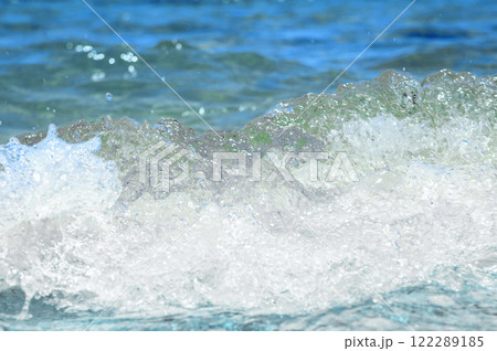 Soft ocean wave. Water movement. Close up of gentle ocean wave. 122289185