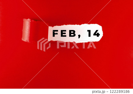 February, 14 message on red paper, torn. Valentine's Day concept. 122289186