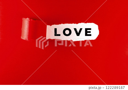 Love message on red paper, torn. Valentine's Day concept. 122289187